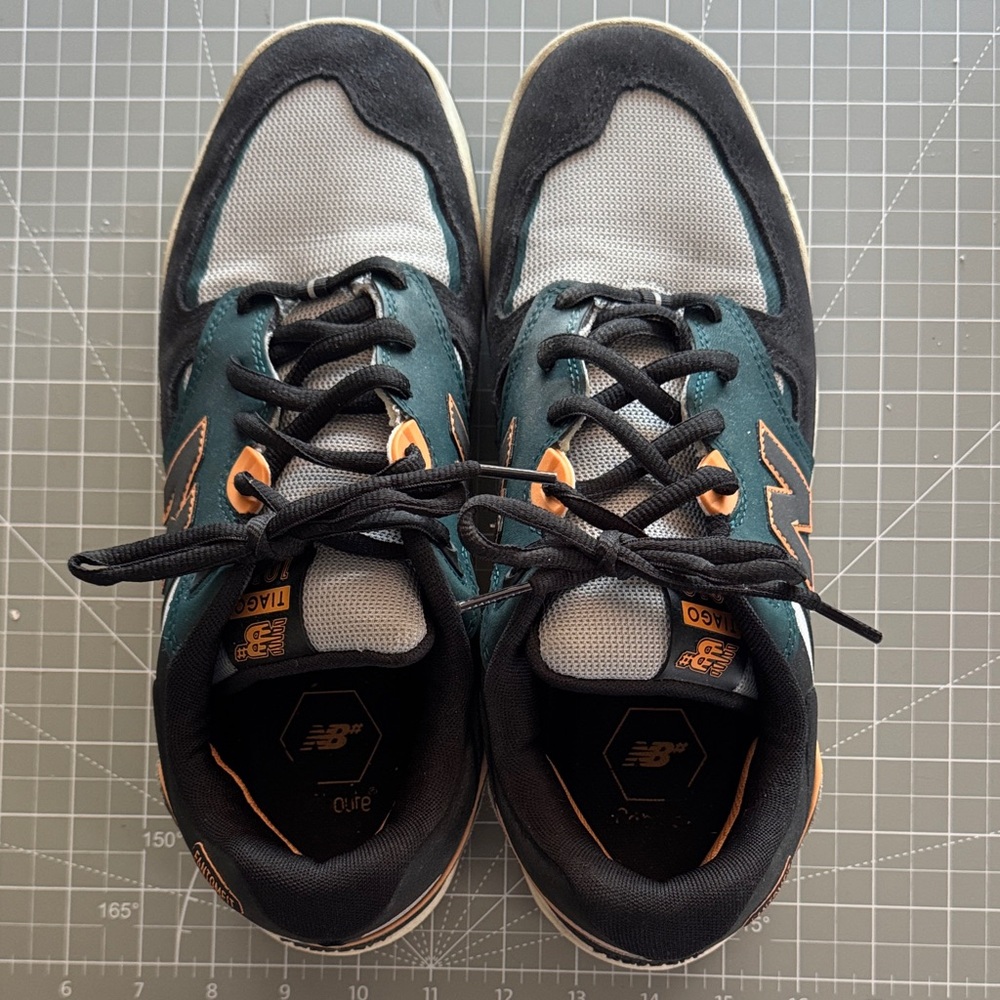 New Balance Black and Teal Shoes with Orange Highlights